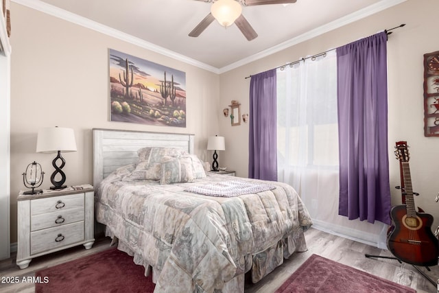 bedroom featuring a ceiling fan, crown molding, and wood finished floors