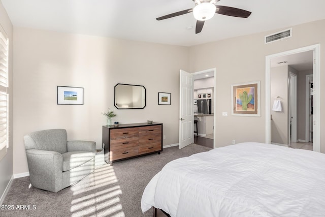 bedroom featuring ceiling fan, light colored carpet, and stainless steel refrigerator