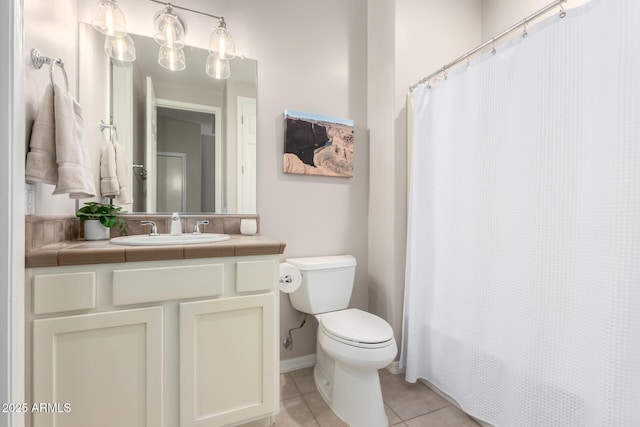 bathroom featuring vanity, toilet, and tile patterned flooring