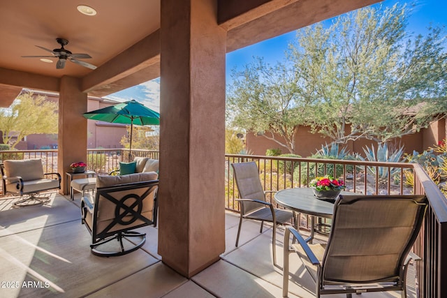 balcony with an outdoor hangout area and ceiling fan