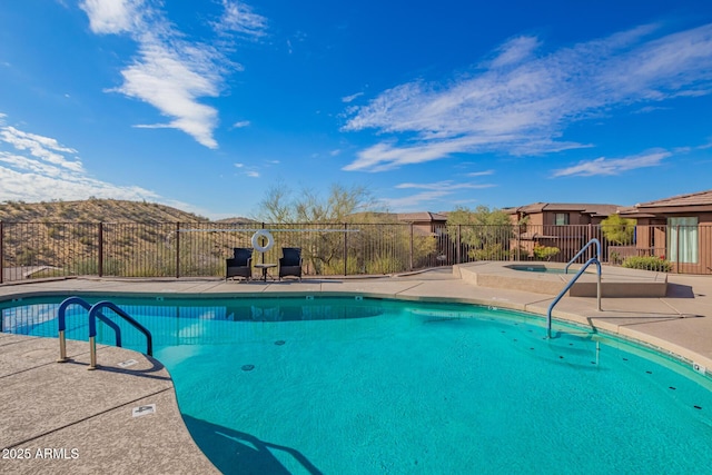 view of pool featuring an in ground hot tub and a patio area