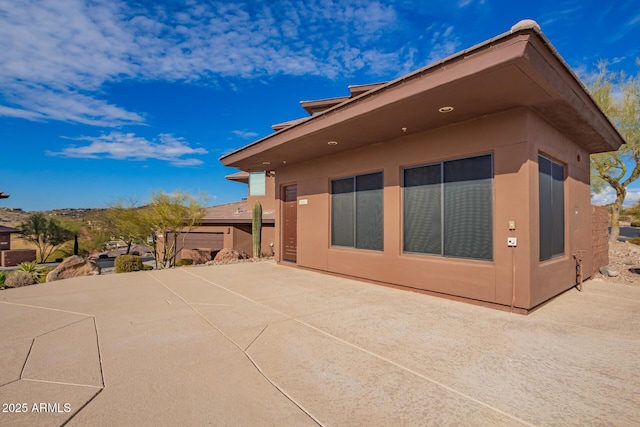 view of home's exterior featuring a patio