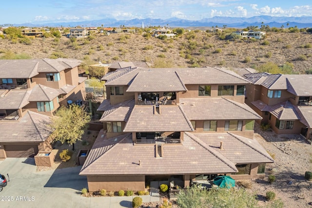 drone / aerial view featuring a mountain view