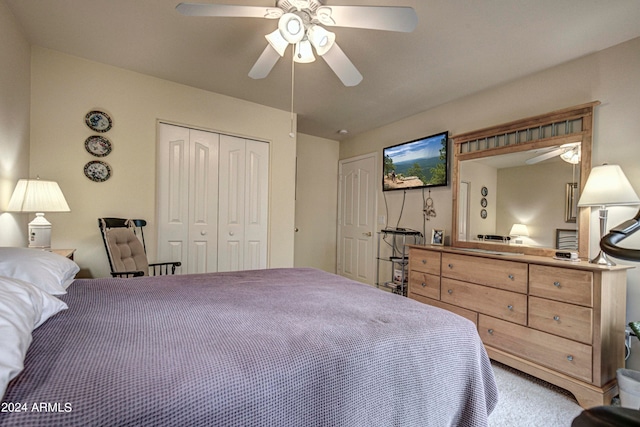 bedroom with ceiling fan, a closet, and carpet