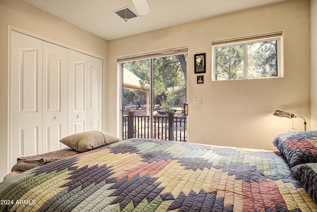 bedroom featuring access to exterior and a closet