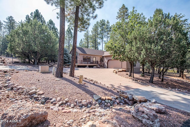 view of front of house with a deck and a garage