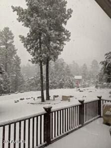 view of snow covered deck