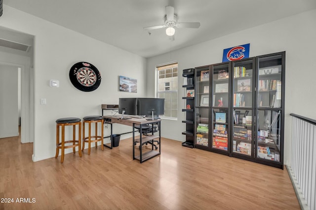 office featuring light hardwood / wood-style floors and ceiling fan