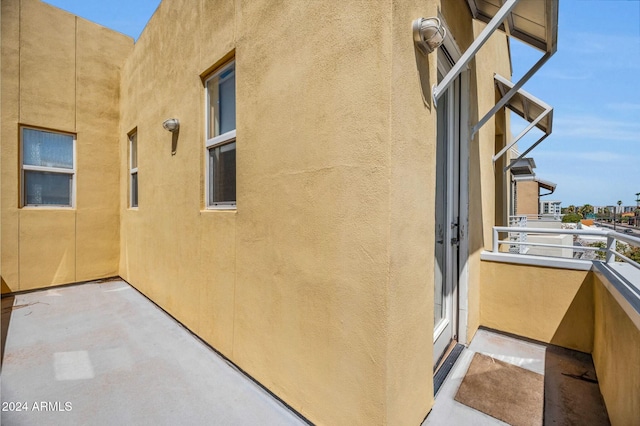 view of side of property featuring a balcony