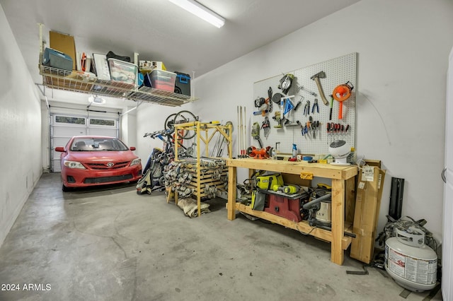 garage with a workshop area