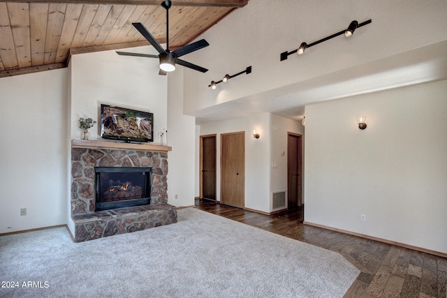 living room featuring a stone fireplace, wooden ceiling, lofted ceiling, ceiling fan, and dark hardwood / wood-style floors