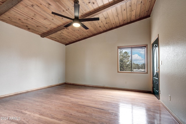 unfurnished room featuring ceiling fan, vaulted ceiling with beams, wood ceiling, and light hardwood / wood-style floors