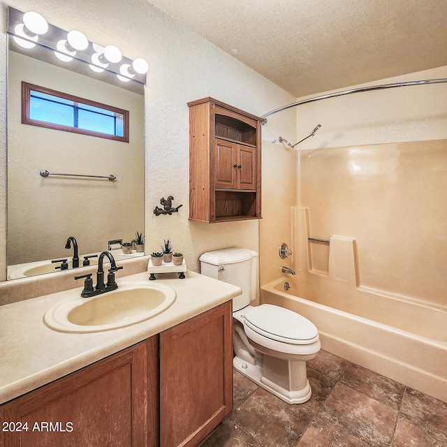 full bathroom with a textured ceiling, shower / bathtub combination, vanity, and toilet