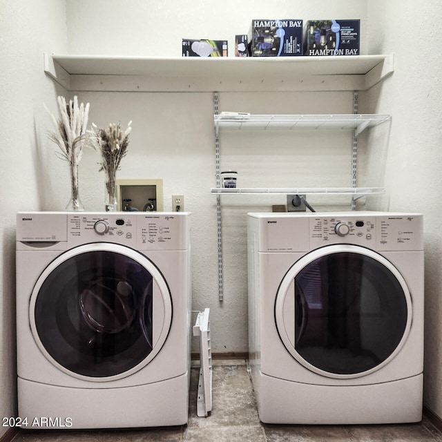 laundry area with washing machine and clothes dryer