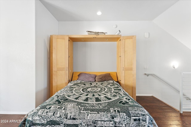 bedroom featuring dark wood-type flooring