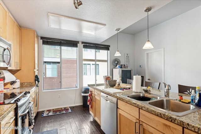 kitchen featuring appliances with stainless steel finishes, dark hardwood / wood-style floors, sink, pendant lighting, and light brown cabinetry