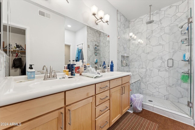 bathroom with walk in shower and dual bowl vanity