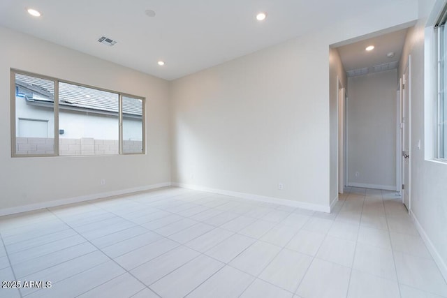 empty room with light tile patterned floors