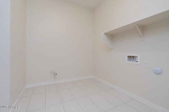 laundry room with hookup for a washing machine, gas dryer hookup, and light tile patterned floors