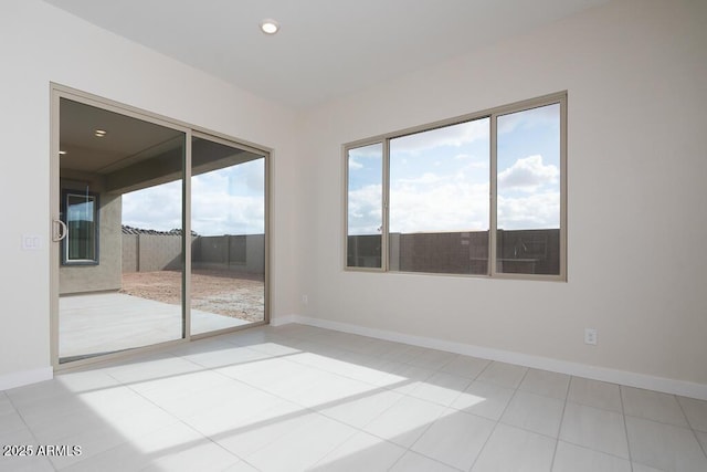 spare room with tile patterned flooring