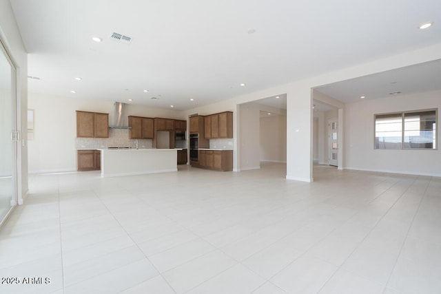 unfurnished living room with light tile patterned flooring