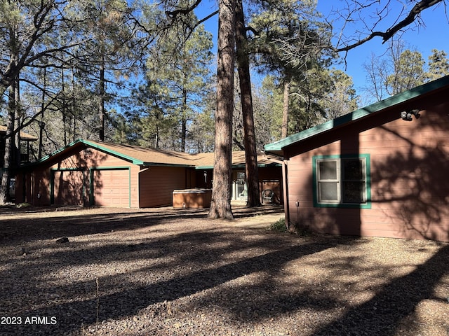 view of property exterior featuring a garage