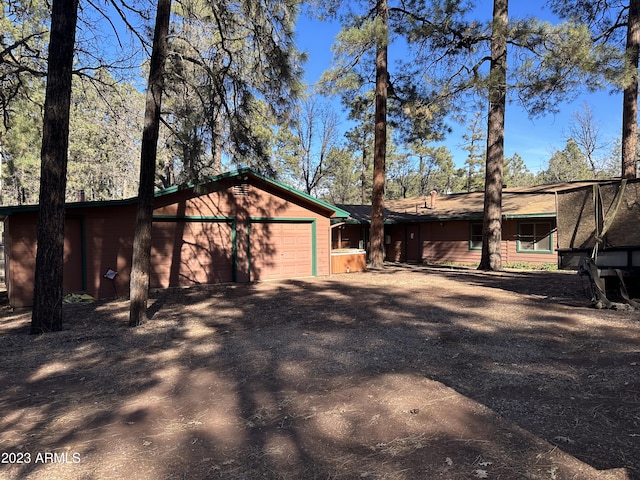 view of side of property featuring a garage