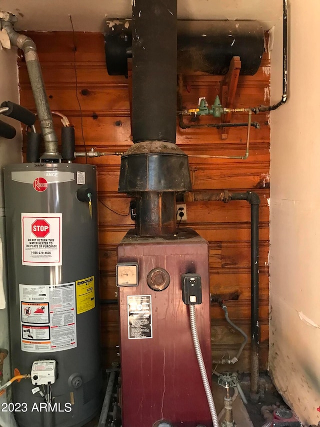 utility room featuring gas water heater