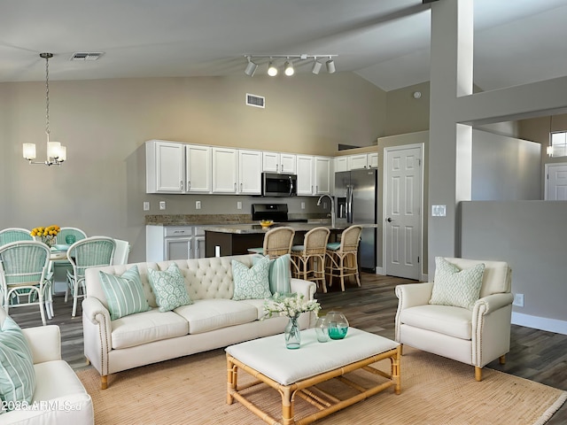 351 N Newport St, Chandler, AZ 85225 - living area featuring wood finished floors, a chandelier, and high vaulted ceiling