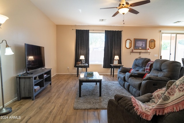 living room with hardwood / wood-style floors and ceiling fan