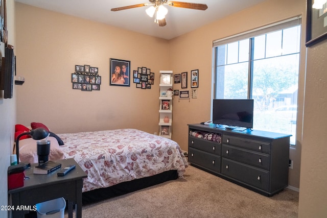 carpeted bedroom featuring ceiling fan