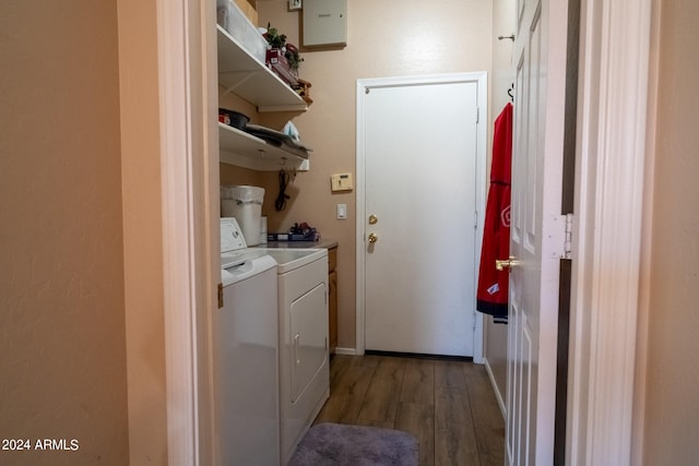 laundry room featuring dark hardwood / wood-style floors and independent washer and dryer