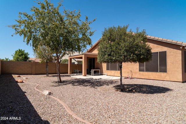 rear view of house featuring a patio area