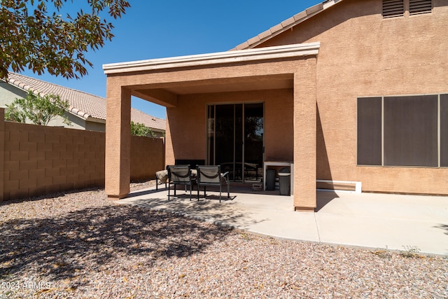 rear view of property featuring a patio