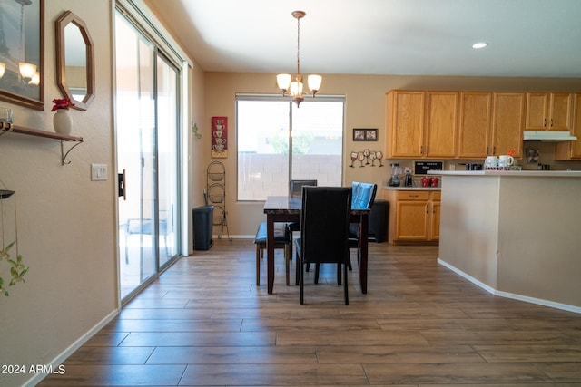 dining room featuring a notable chandelier and dark hardwood / wood-style floors