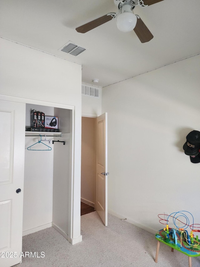 7251 E Grouse Ct, San Tan Valley, AZ 85143 - unfurnished bedroom with a closet, light carpet, ceiling fan, baseboards, and visible vents
