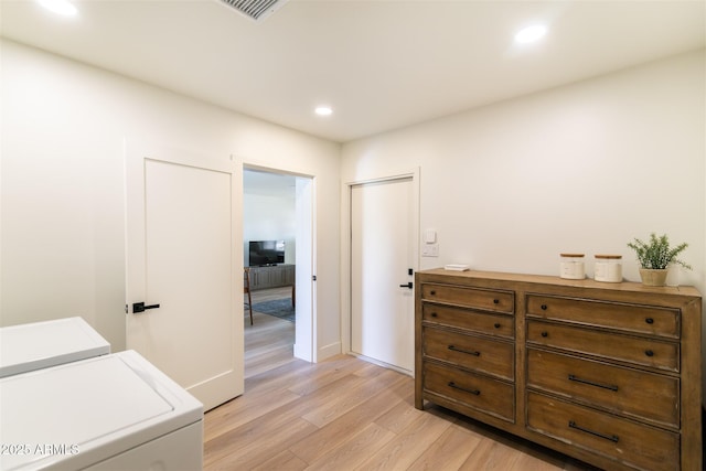 hall with separate washer and dryer, light wood-style floors, recessed lighting, and baseboards