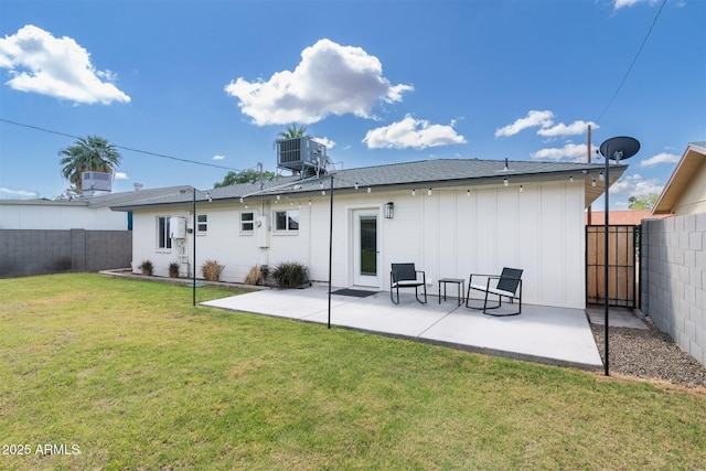 back of property featuring board and batten siding, central air condition unit, and a patio