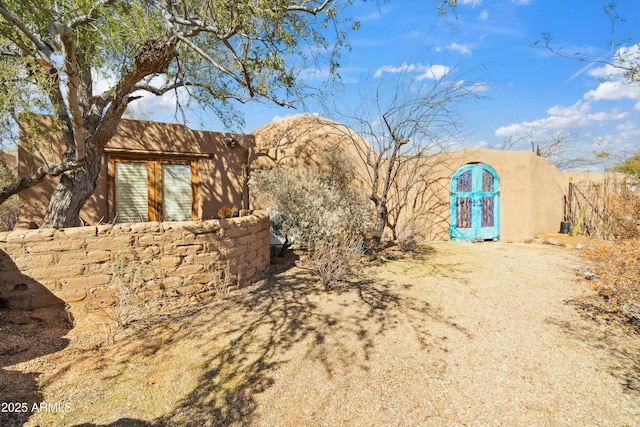 exterior space featuring stucco siding