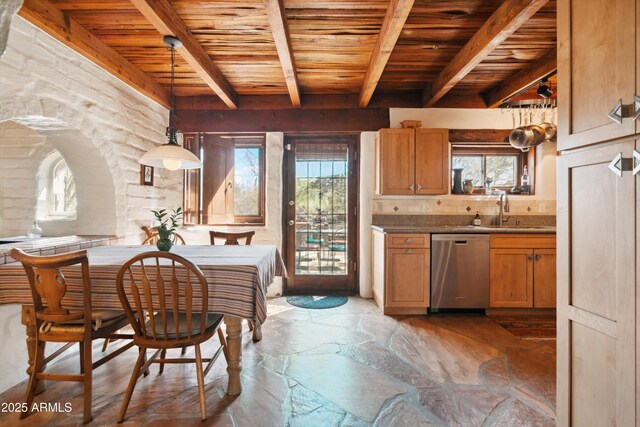 dining room featuring stone tile flooring, beam ceiling, and wood ceiling