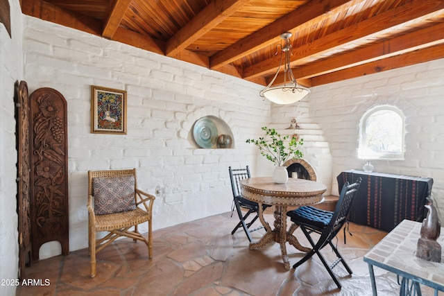 dining area featuring wooden ceiling and beamed ceiling