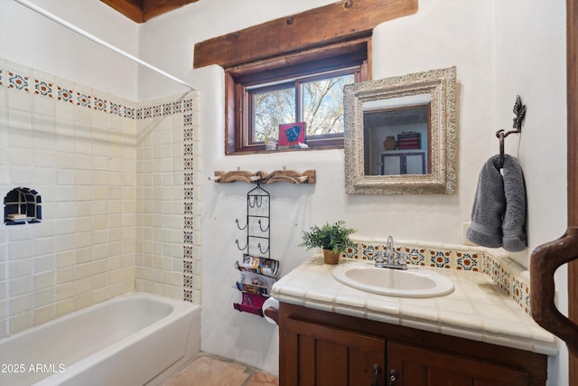 bathroom with bathing tub / shower combination and vanity