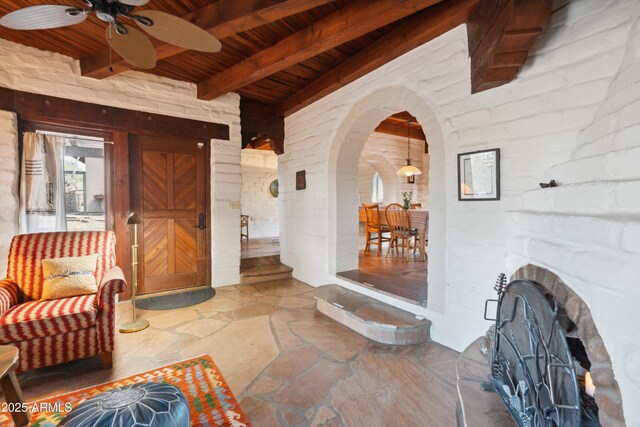view of exterior entry featuring ceiling fan
