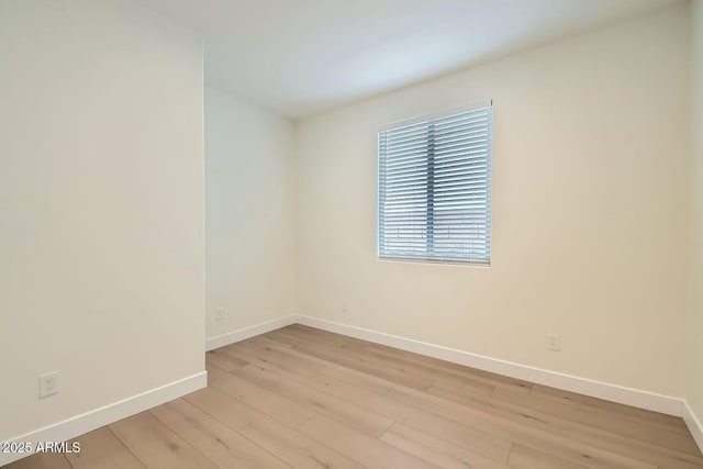 spare room with light hardwood / wood-style floors