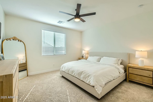 bedroom featuring ceiling fan and light carpet