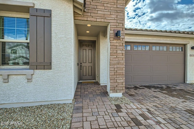 doorway to property featuring a garage