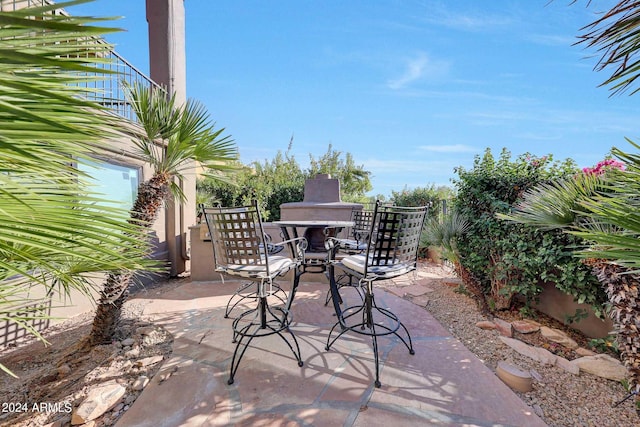 view of patio featuring exterior fireplace