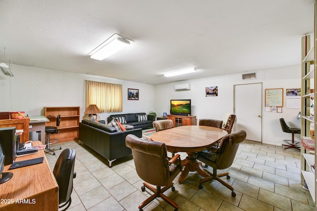 dining room with light tile patterned floors, visible vents, and a wall mounted AC