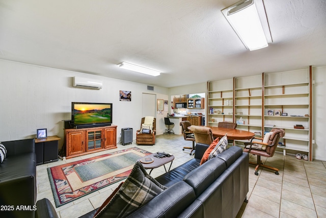 living area featuring light tile patterned floors, visible vents, and a wall mounted AC