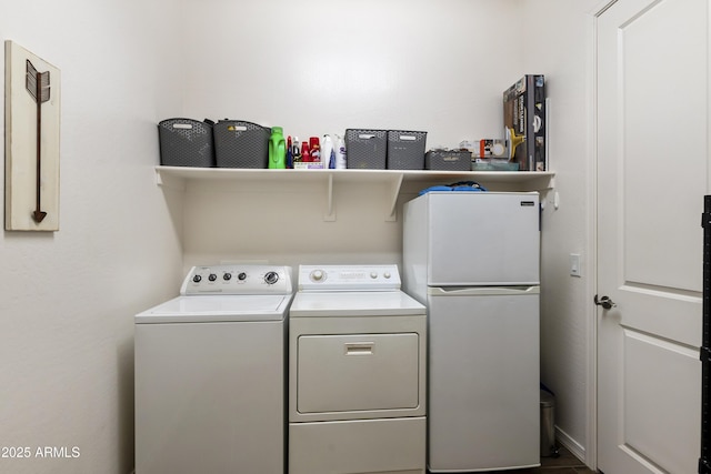 washroom with laundry area and separate washer and dryer